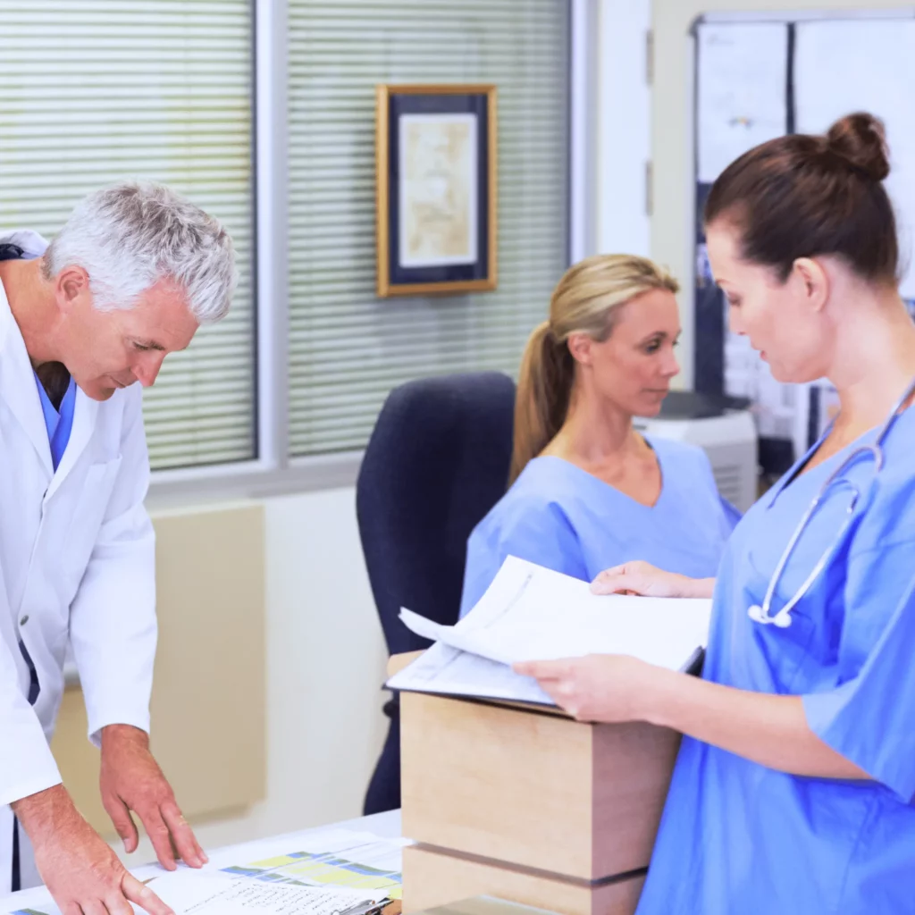 nurse checking with doctor